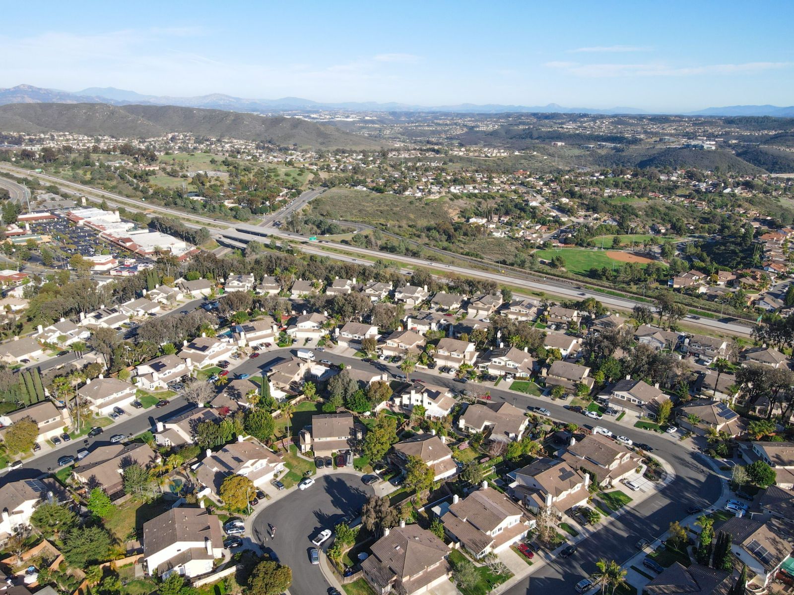 Aerial view of residential neighborhoods in the Fraser Valley, BC, showcasing the suburban communities served by Gator Plumbing & Drainage.